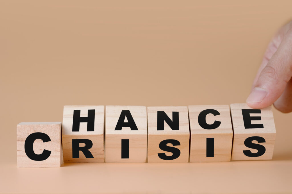 Hand flipping wooden cubes for change wording” Crisis ” to ” Chance”. Mindset is important for human development. Crisis Communications Albany, NY